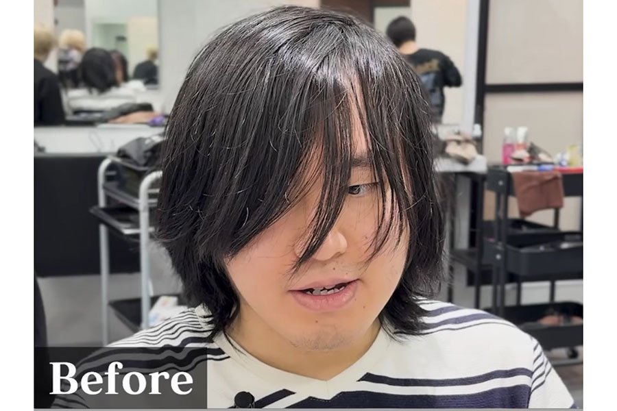 伸び切った髪で目元が隠れている男性（スクリーンショット）